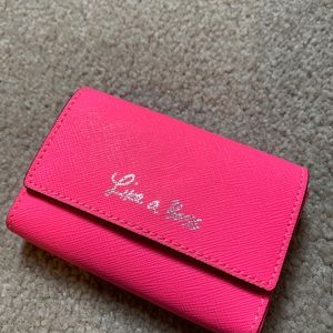 Rebecca Minkoff bright pink card holder.